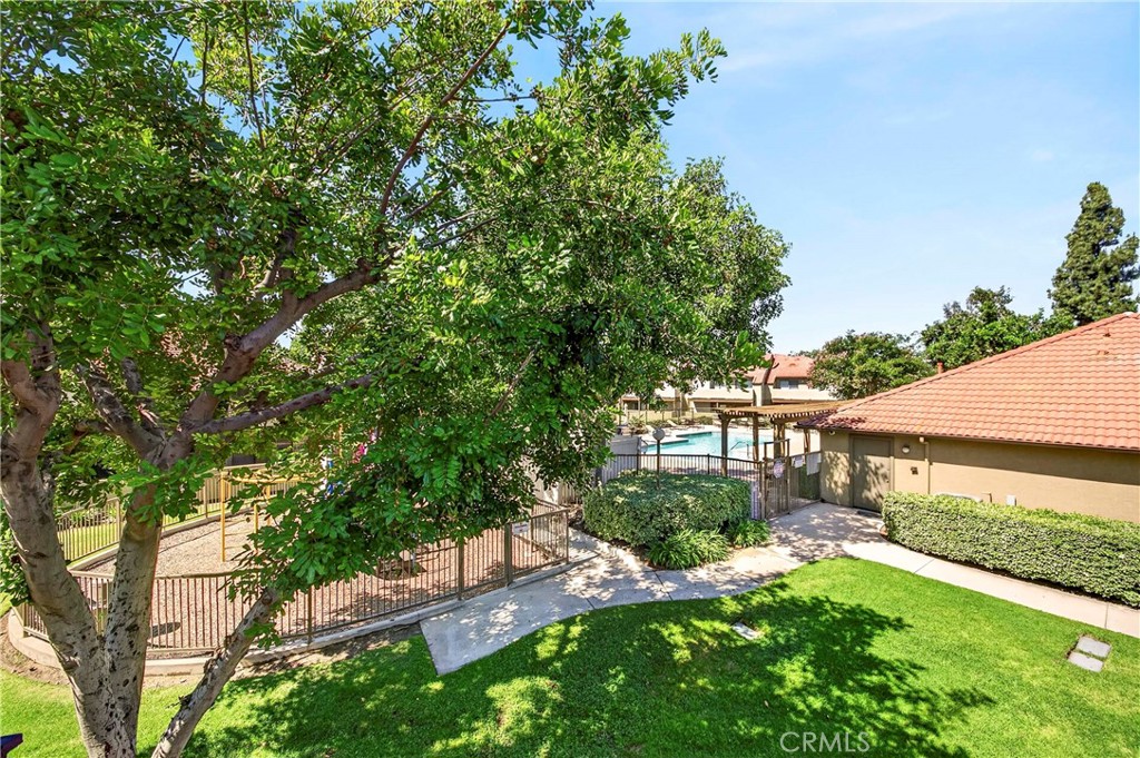 10151 Arrow Route, Unit 26 Rancho Cucamonga, CA 91730 - Photo 29 of 35 a view of backyard of house with green space