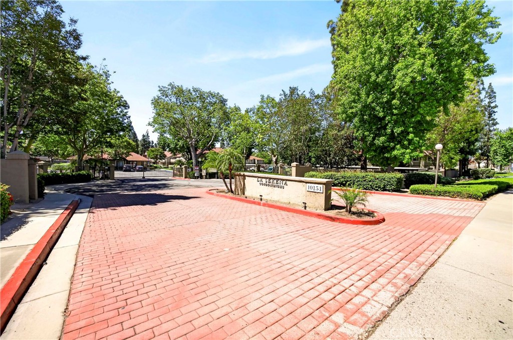 10151 Arrow Route, Unit 26 Rancho Cucamonga, CA 91730 - Photo 34 of 35 a view of a swimming pool with a patio