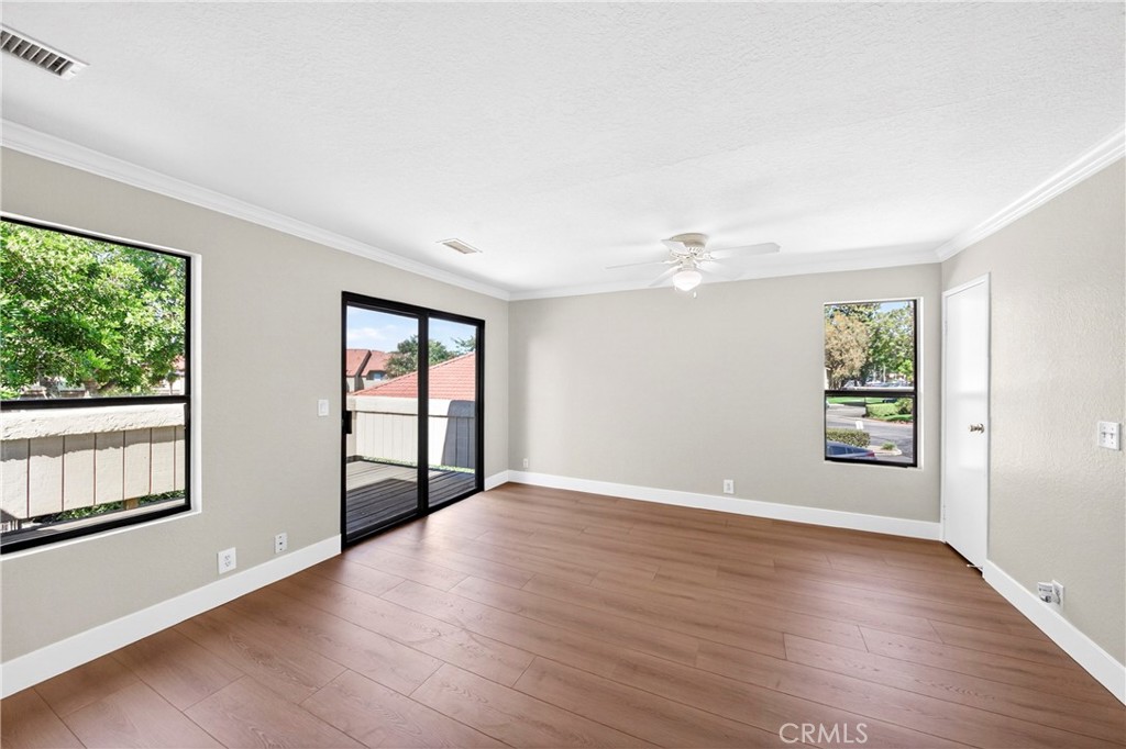 10151 Arrow Route, Unit 26 Rancho Cucamonga, CA 91730 - Photo 10 of 35 wooden floor in an empty room with a window