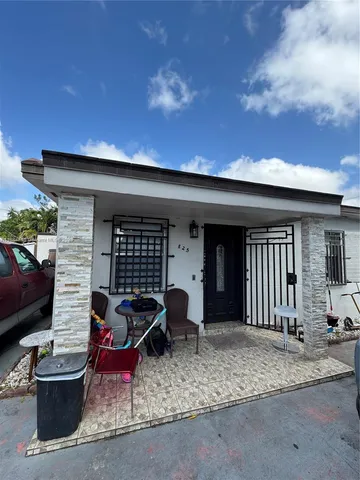 a front view of a house with patio
