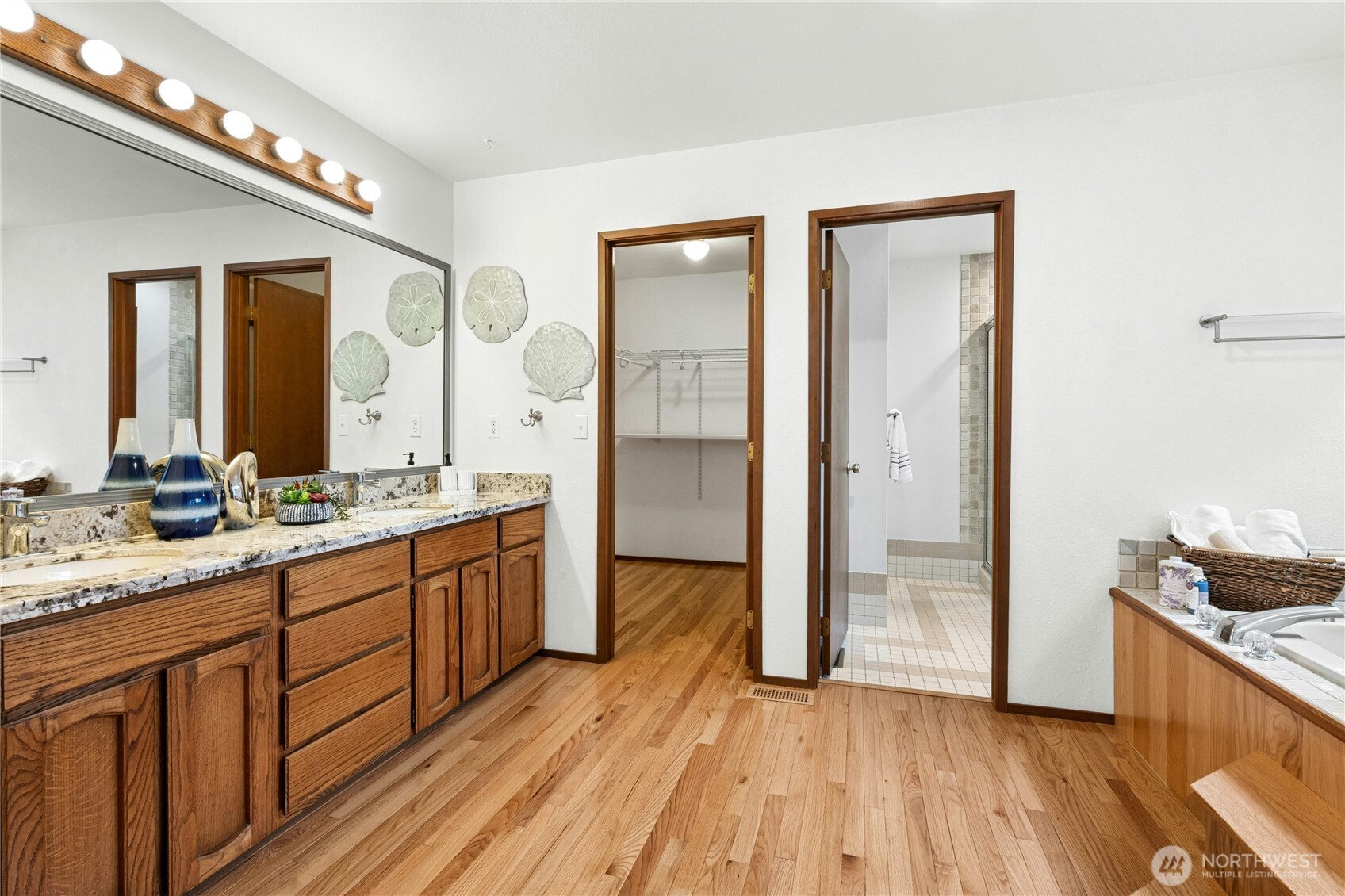 5211 103rd Street Southwest, Unit SW Mukilteo, WA 98275 - Photo 19 of 40 a bathroom with a sink and a mirror