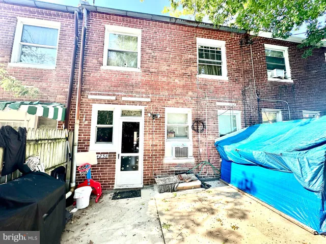 a backyard of a house with seating space