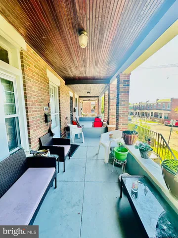 a living room filled with furniture and a chandelier