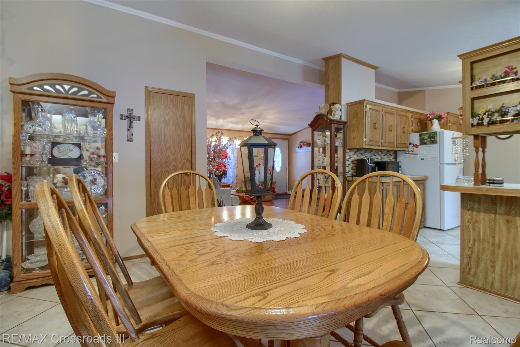 48620 Wear Road Belleville, MI 48111 - Photo 10 of 24 Dining space with light tile patterned flooring and crown molding
