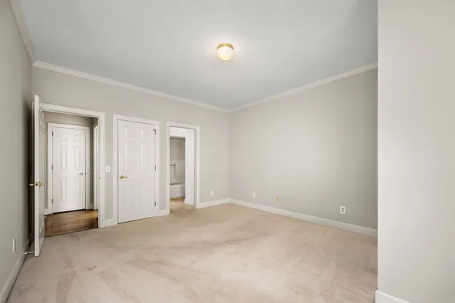 a view of a house with a yard covered in snow