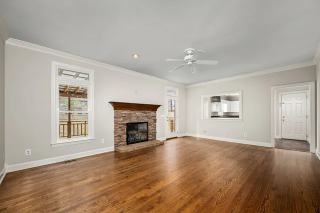 a kitchen with granite countertop a sink stove and refrigerator