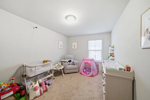 a bedroom with furniture and a bed