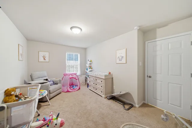 a bedroom with a workspace