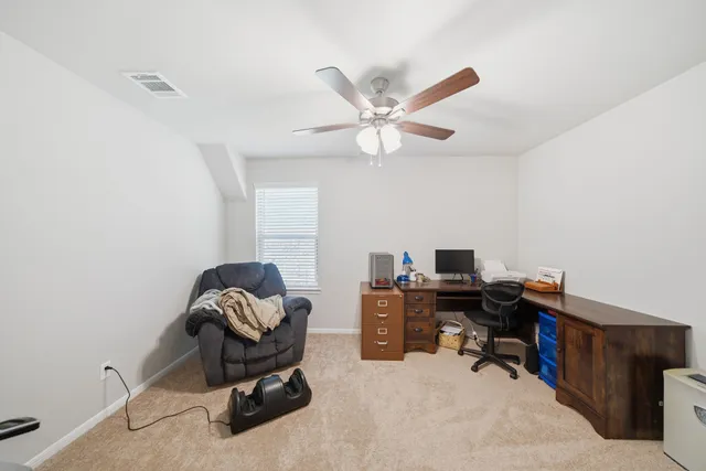 a view of a workspace with furniture