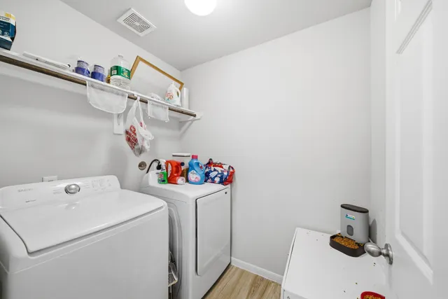 a view of storage and utility room with a washer and dryer