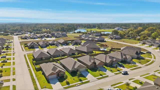 an aerial view of residential houses with outdoor space