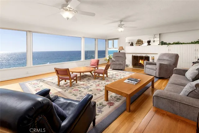 a living room with furniture fireplace and a table