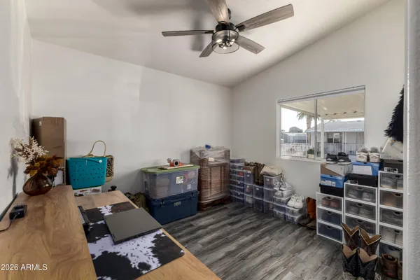 a bedroom with furniture and a window