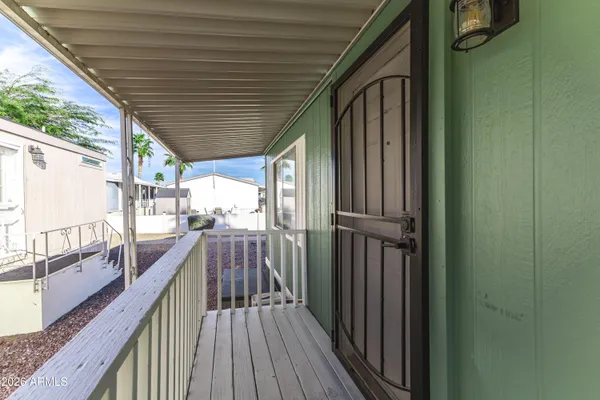 a view of balcony with wooden floor
