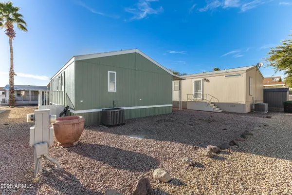 a view of a backyard with potted plants