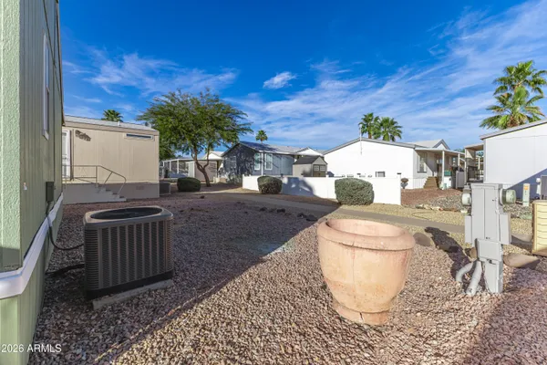 a view of a backyard with table and chairs