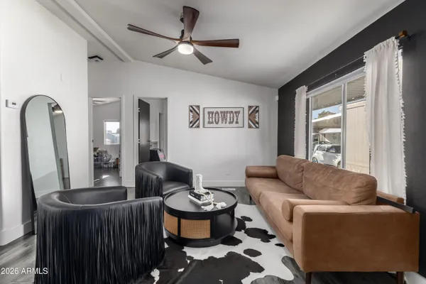 a living room with furniture and a large window
