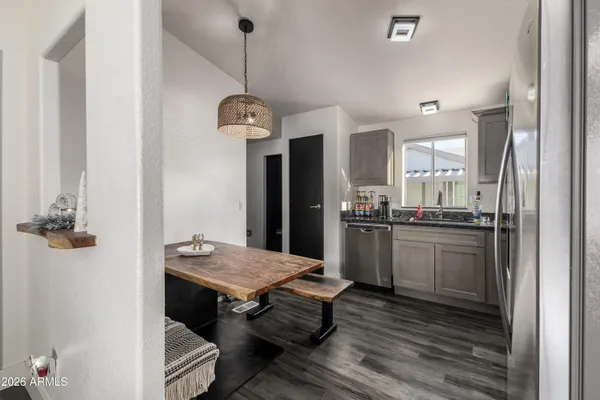 a kitchen with a table and chairs in it