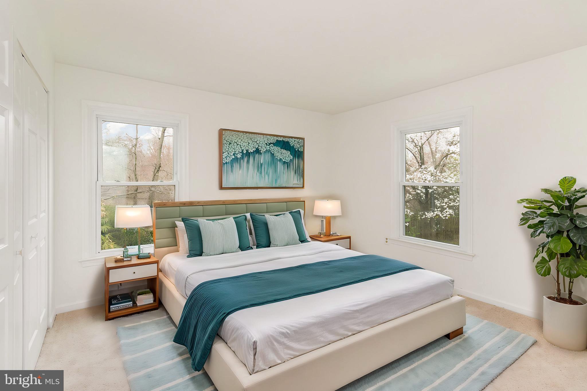 7715 Fort Hunt Road Alexandria, VA 22308 - Photo 12 of 21 a bedroom with a large bed and a potted plant