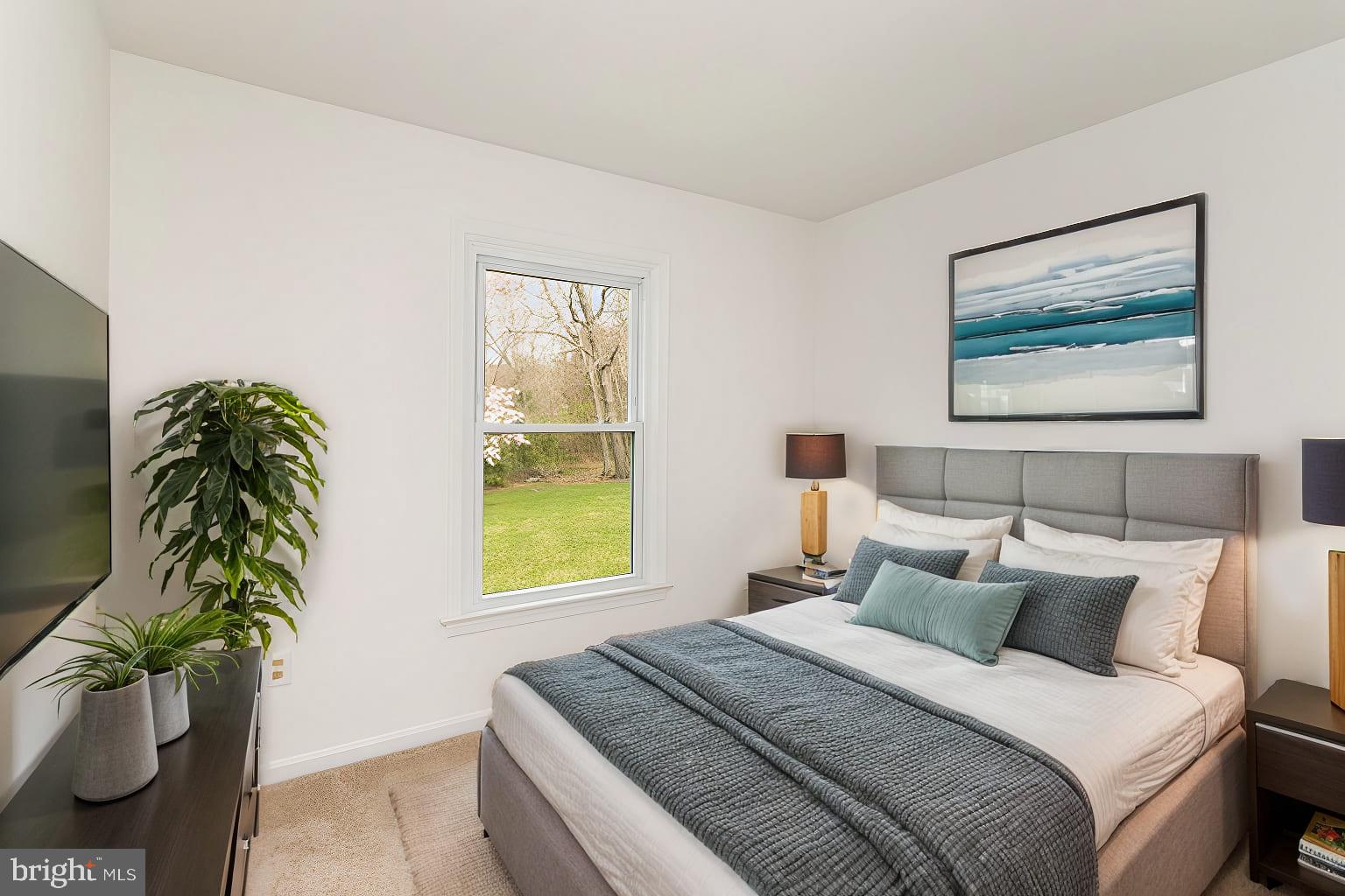 7715 Fort Hunt Road Alexandria, VA 22308 - Photo 13 of 21 a bedroom with a bed and a potted plant