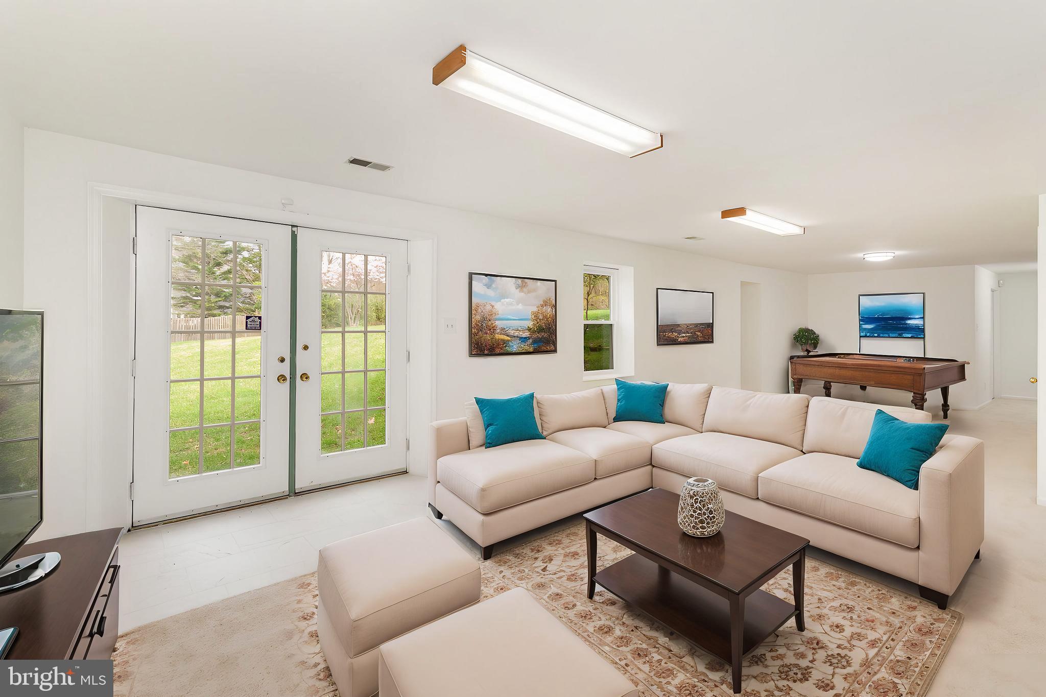 7715 Fort Hunt Road Alexandria, VA 22308 - Photo 14 of 21 a living room with furniture and a large window