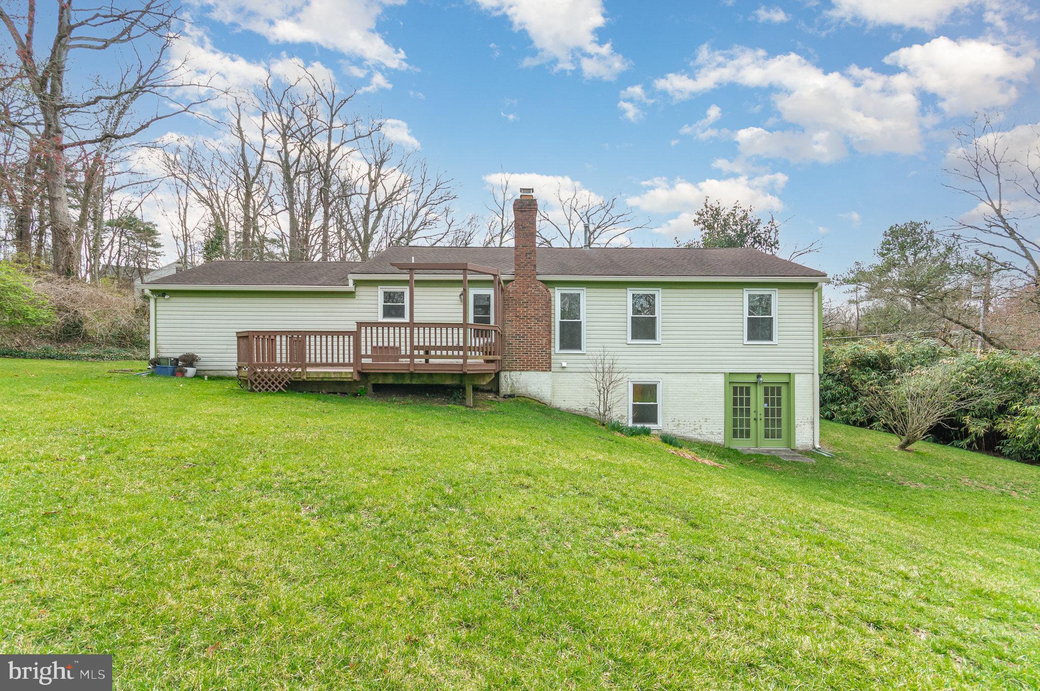 7715 Fort Hunt Road Alexandria, VA 22308 - Photo 18 of 21 a view of a house with a backyard