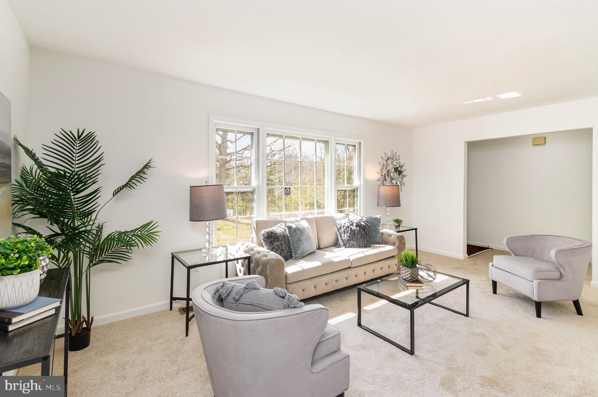 7715 Fort Hunt Road Alexandria, VA 22308 - Photo 2 of 21 a living room with furniture and a large window