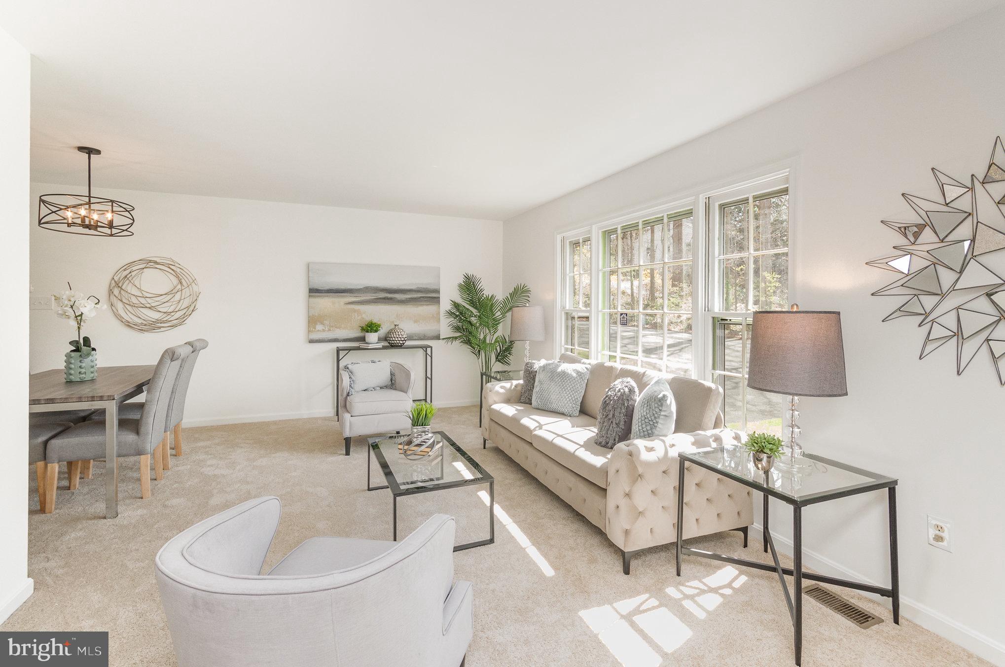 7715 Fort Hunt Road Alexandria, VA 22308 - Photo 3 of 21 a living room with furniture a chandelier and a window