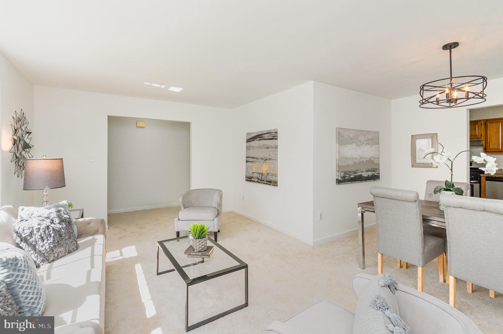 7715 Fort Hunt Road Alexandria, VA 22308 - Photo 5 of 21 a living room with furniture and a wooden floor