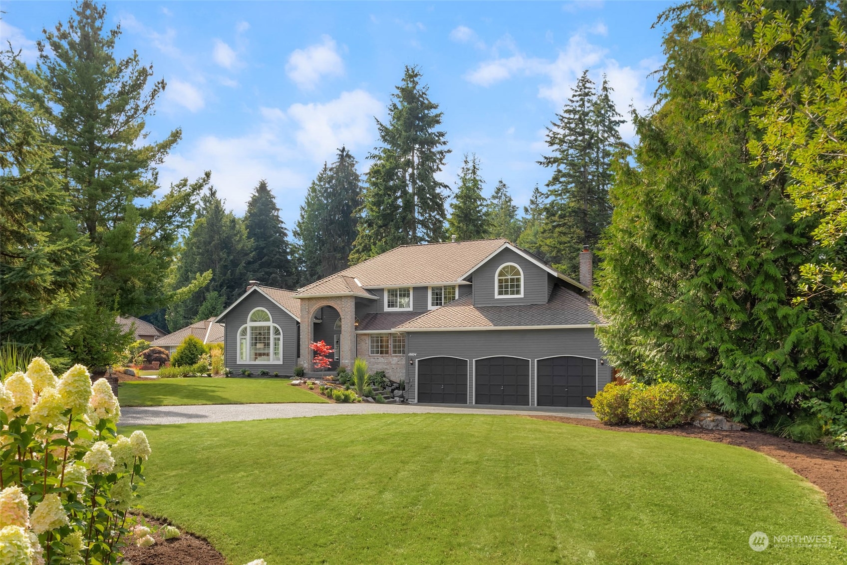 18604 29th Avenue Southeast Bothell, WA 98012 - Photo 1 of 40 a front view of house with yard and green space