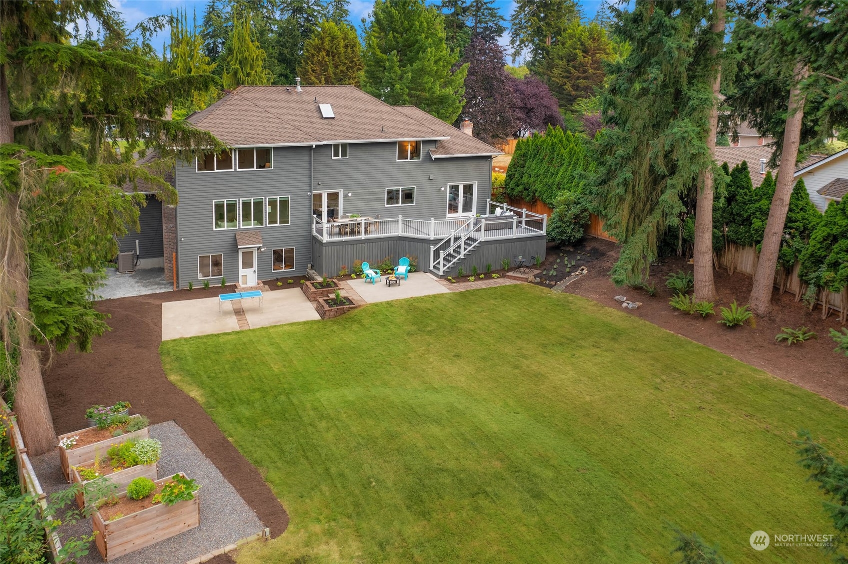 18604 29th Avenue Southeast Bothell, WA 98012 - Photo 11 of 40 a view of a house with backyard porch and sitting area