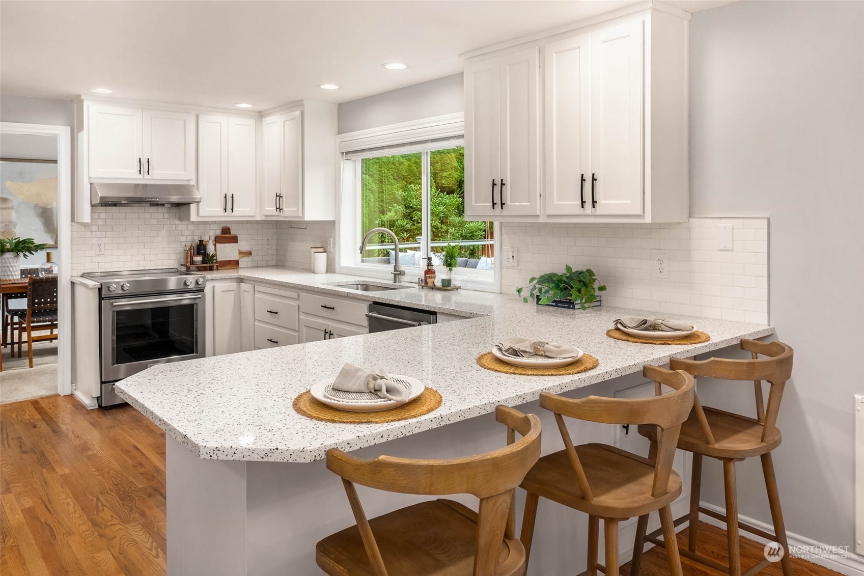 18604 29th Avenue Southeast Bothell, WA 98012 - Photo 17 of 40 a kitchen with a stove a white table and chairs