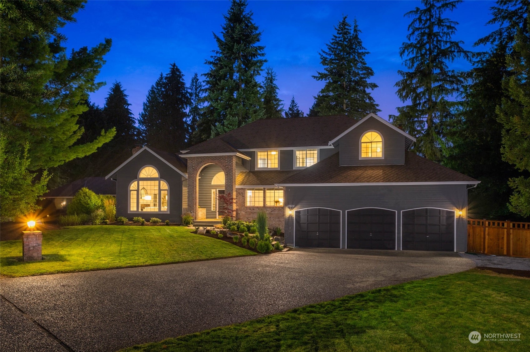 18604 29th Avenue Southeast Bothell, WA 98012 - Photo 2 of 40 a front view of a house with a yard and garage
