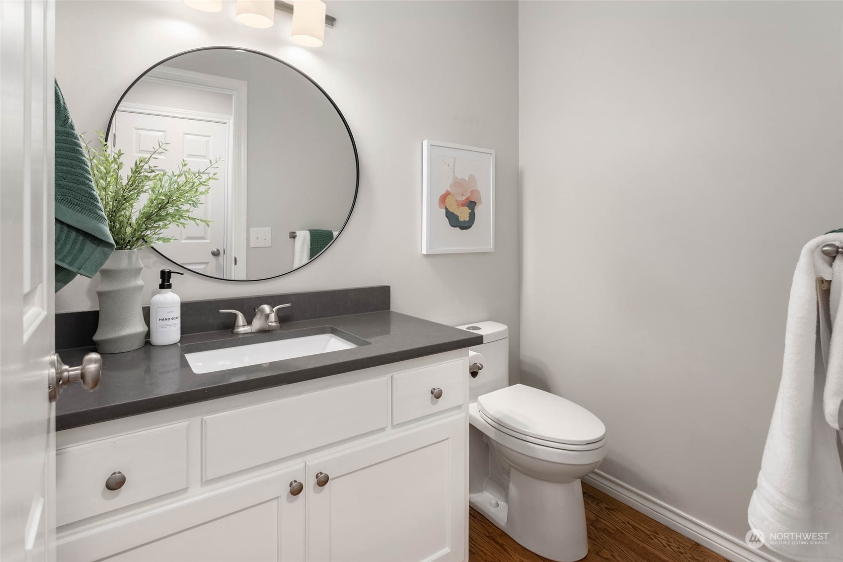 18604 29th Avenue Southeast Bothell, WA 98012 - Photo 22 of 40 a bathroom with a granite countertop toilet sink mirror and vanity