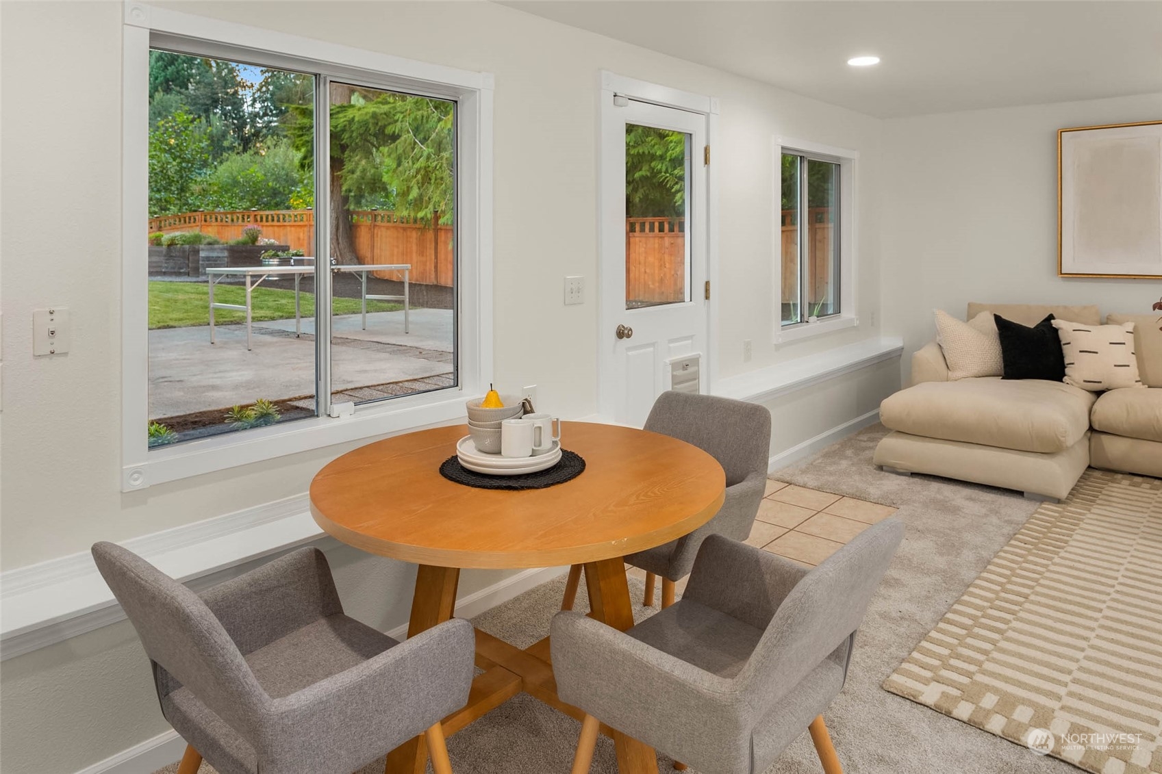 18604 29th Avenue Southeast Bothell, WA 98012 - Photo 29 of 40 a living room with furniture a table and a window