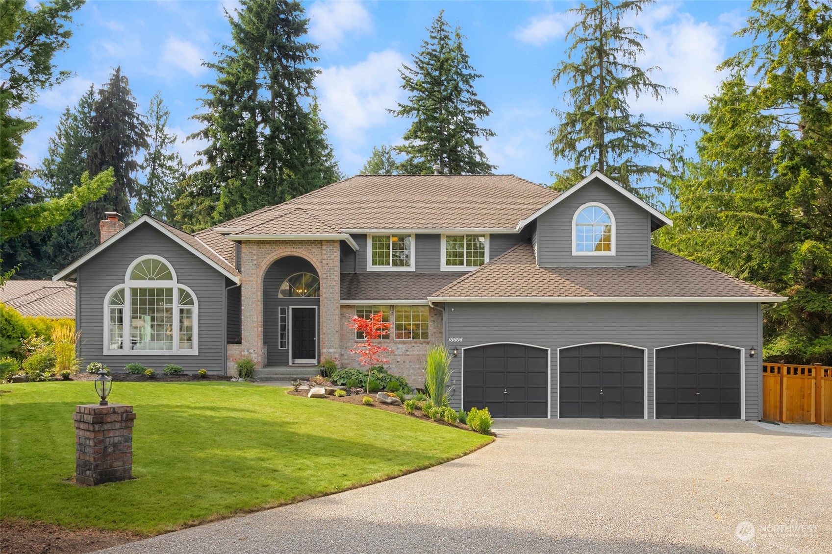 18604 29th Avenue Southeast Bothell, WA 98012 - Photo 40 of 40 a front view of a house with a garden