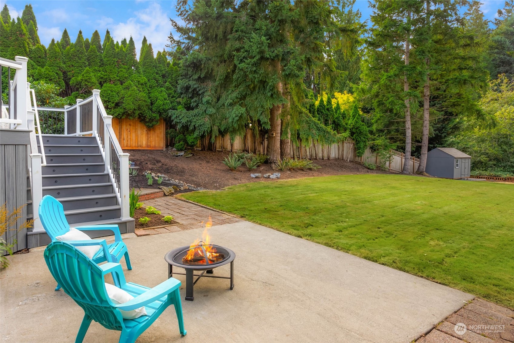 18604 29th Avenue Southeast Bothell, WA 98012 - Photo 10 of 40 a backyard of a house with table and chairs