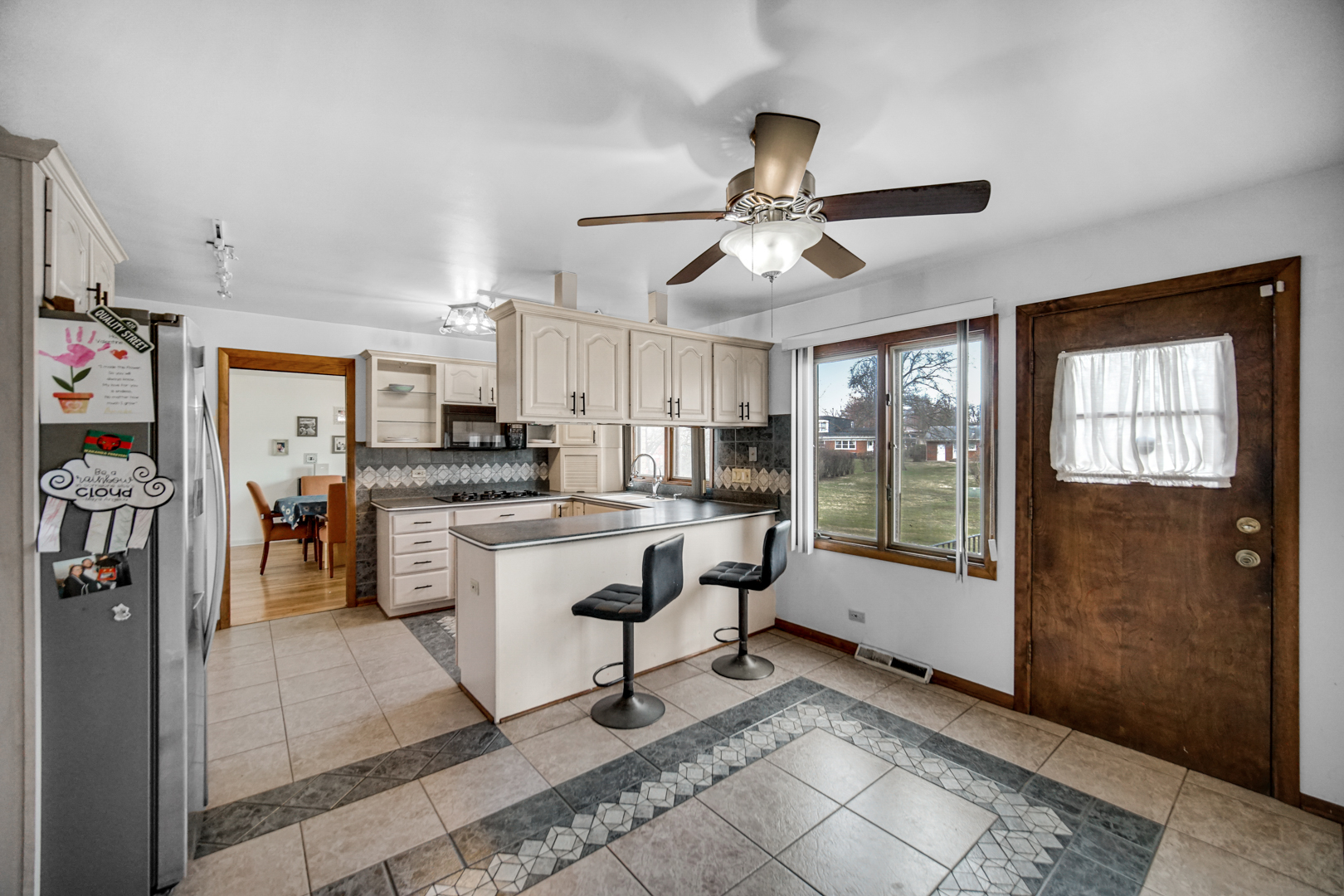 2945 Bob O Link Road Flossmoor, IL 60422 - Photo 12 of 24 a room with stainless steel appliances kitchen island granite countertop furniture and a rug
