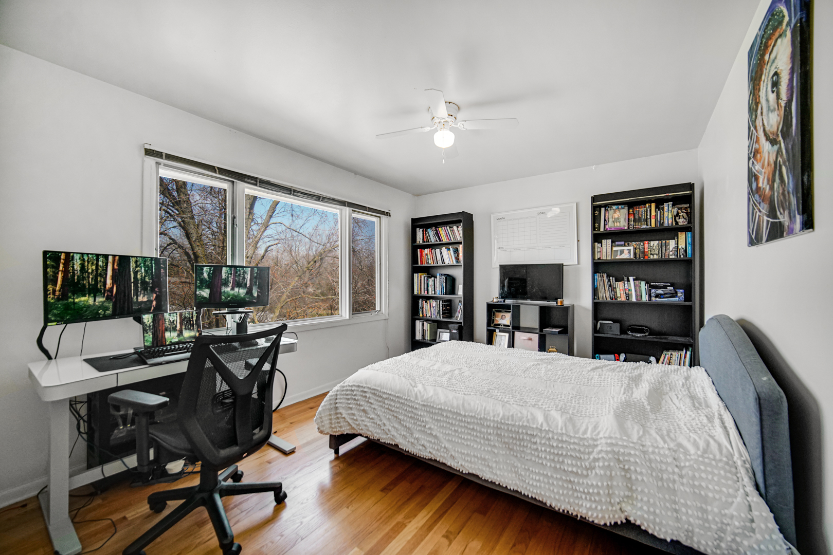 2945 Bob O Link Road Flossmoor, IL 60422 - Photo 21 of 24 a bedroom with a bed a table and large windows