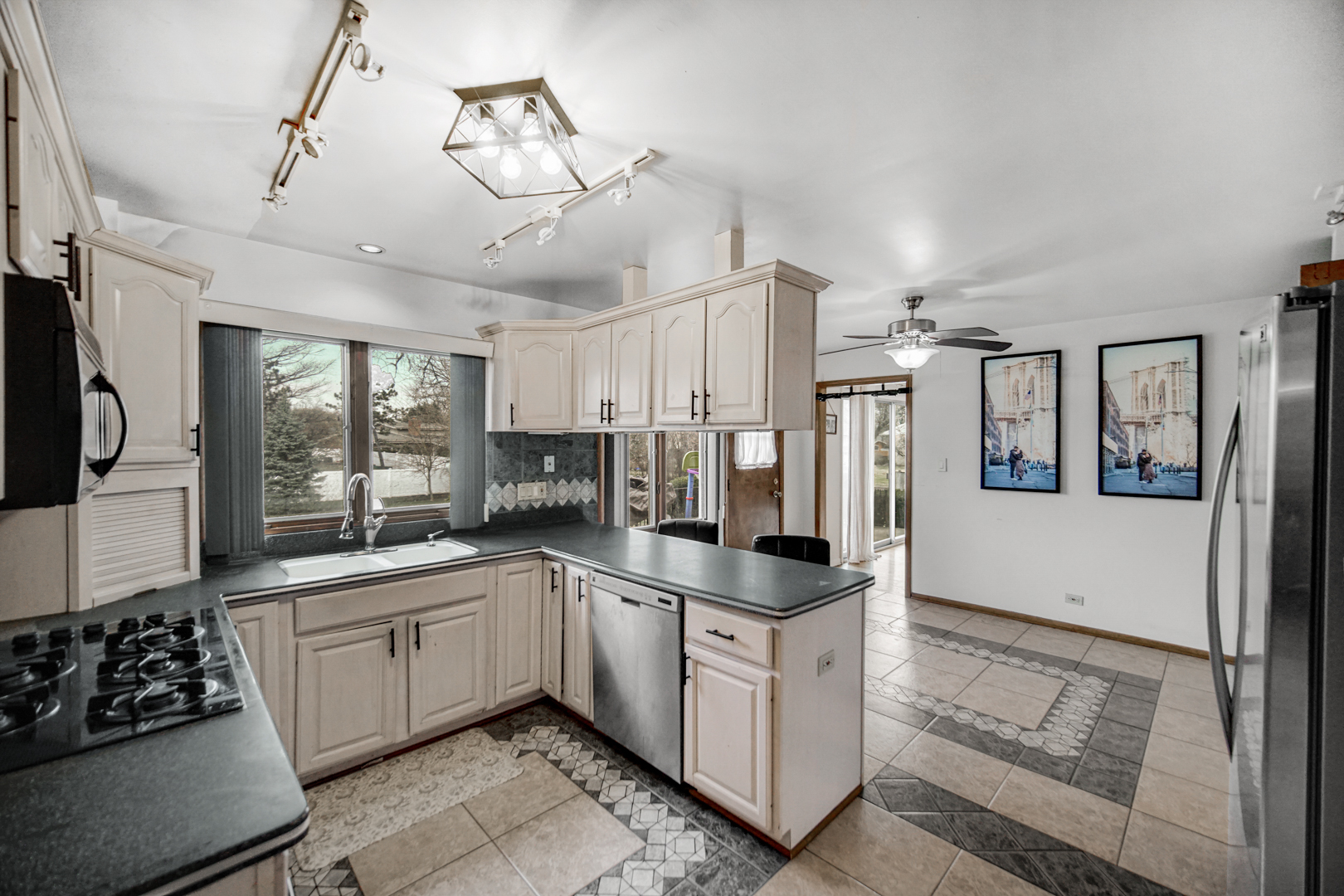 2945 Bob O Link Road Flossmoor, IL 60422 - Photo 10 of 24 a kitchen with a sink and refrigerator