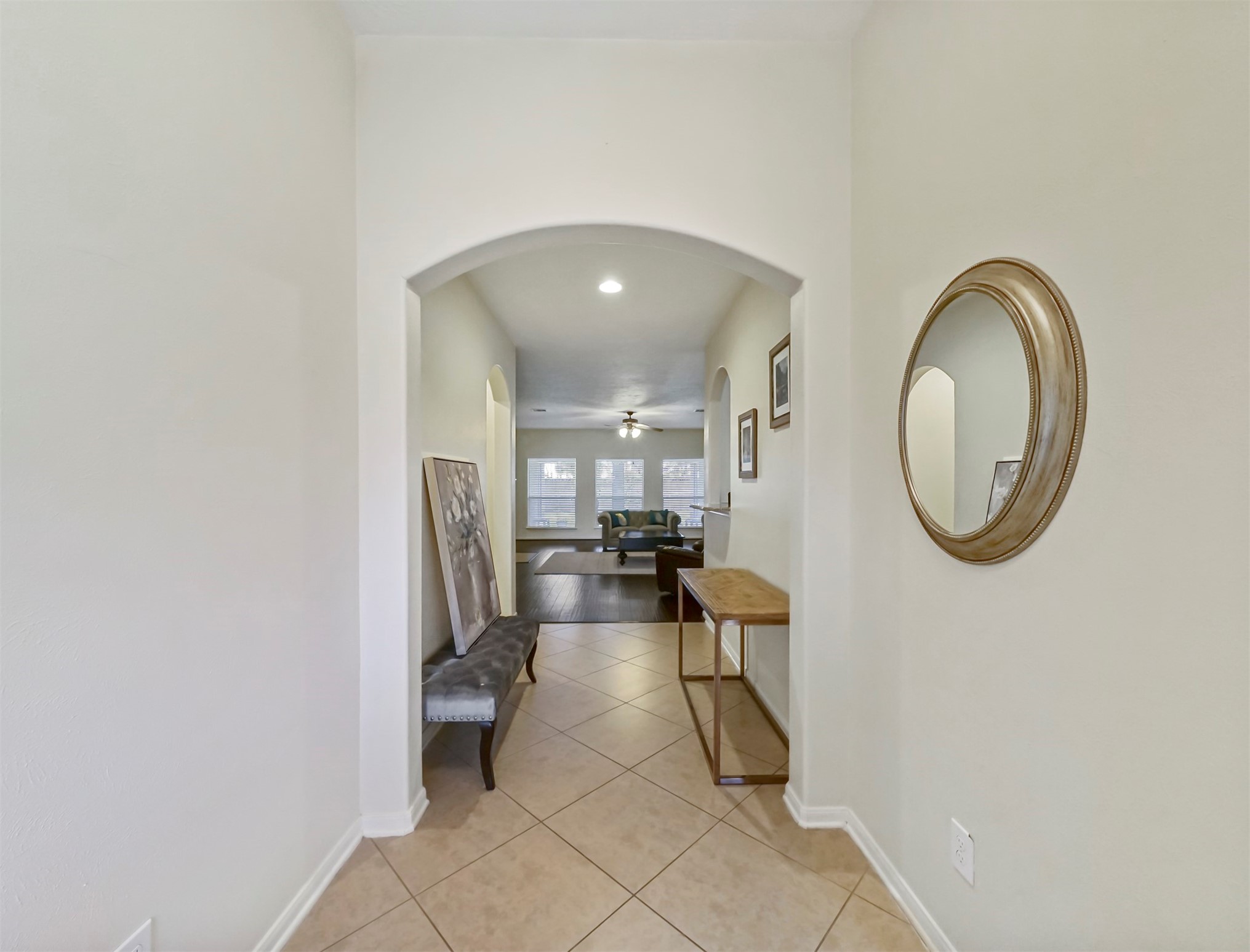 8214 Garrison Point Drive Houston, TX 77040 - Photo 2 of 37 a living room with furniture and a mirror
