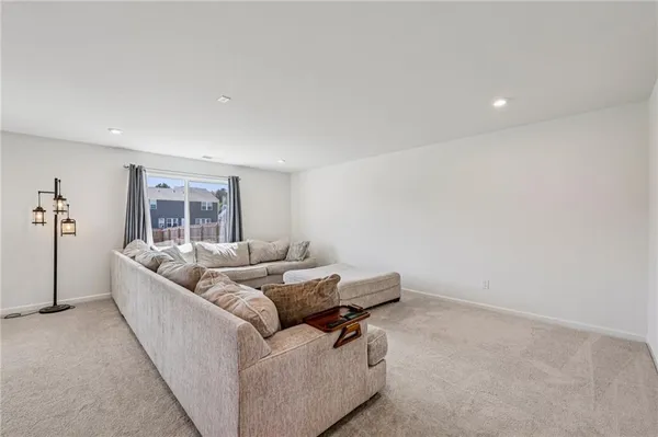 a living room with furniture and window