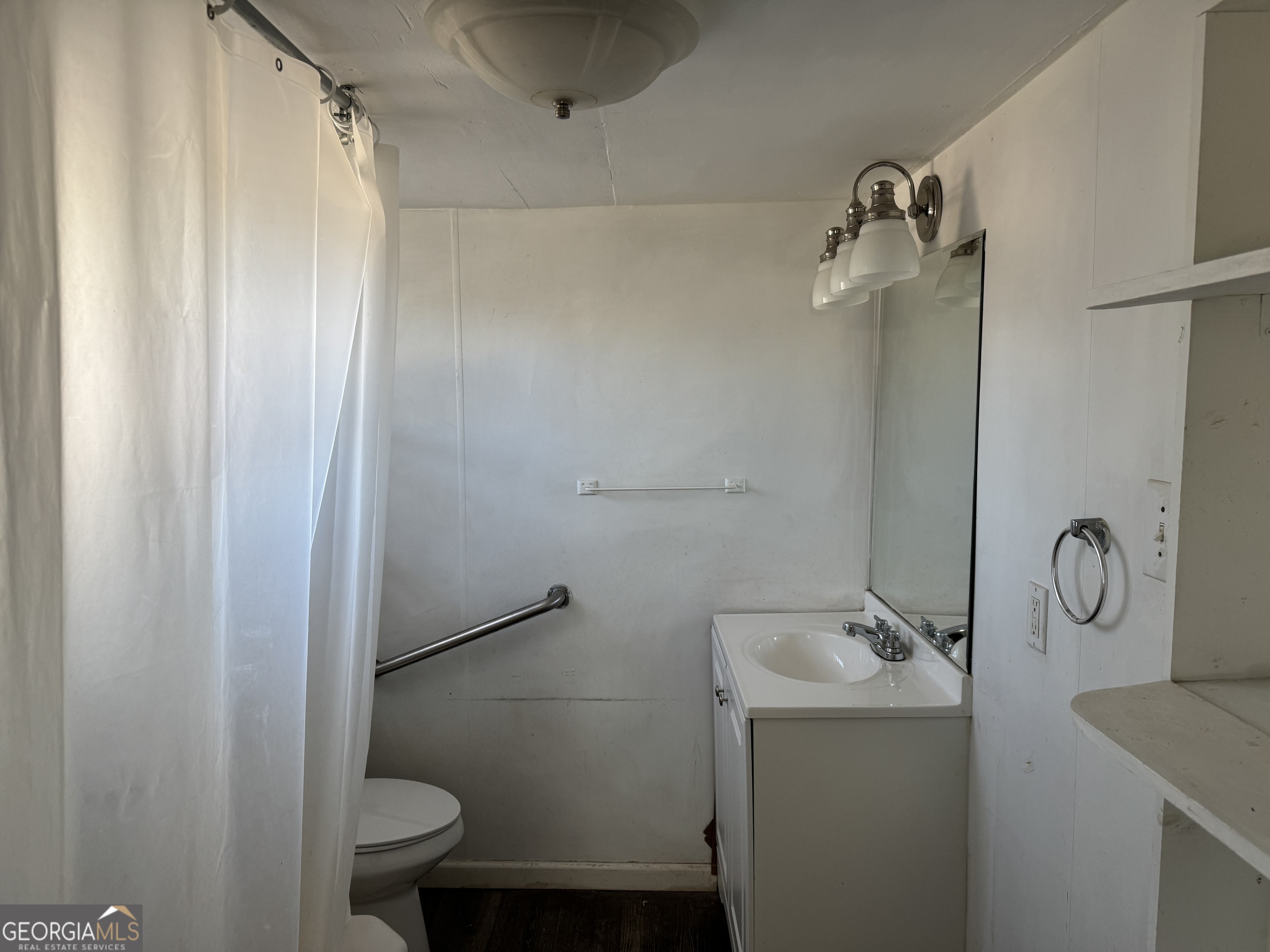 406 Shankle Road Commerce, GA 30529 - Photo 14 of 19 a bathroom with a granite countertop sink toilet and shower