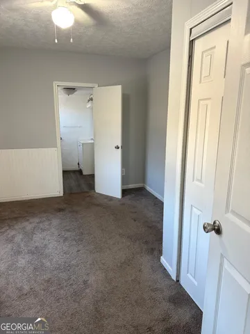 a view of a room with a bathroom