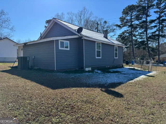 a view of a backyard of the house