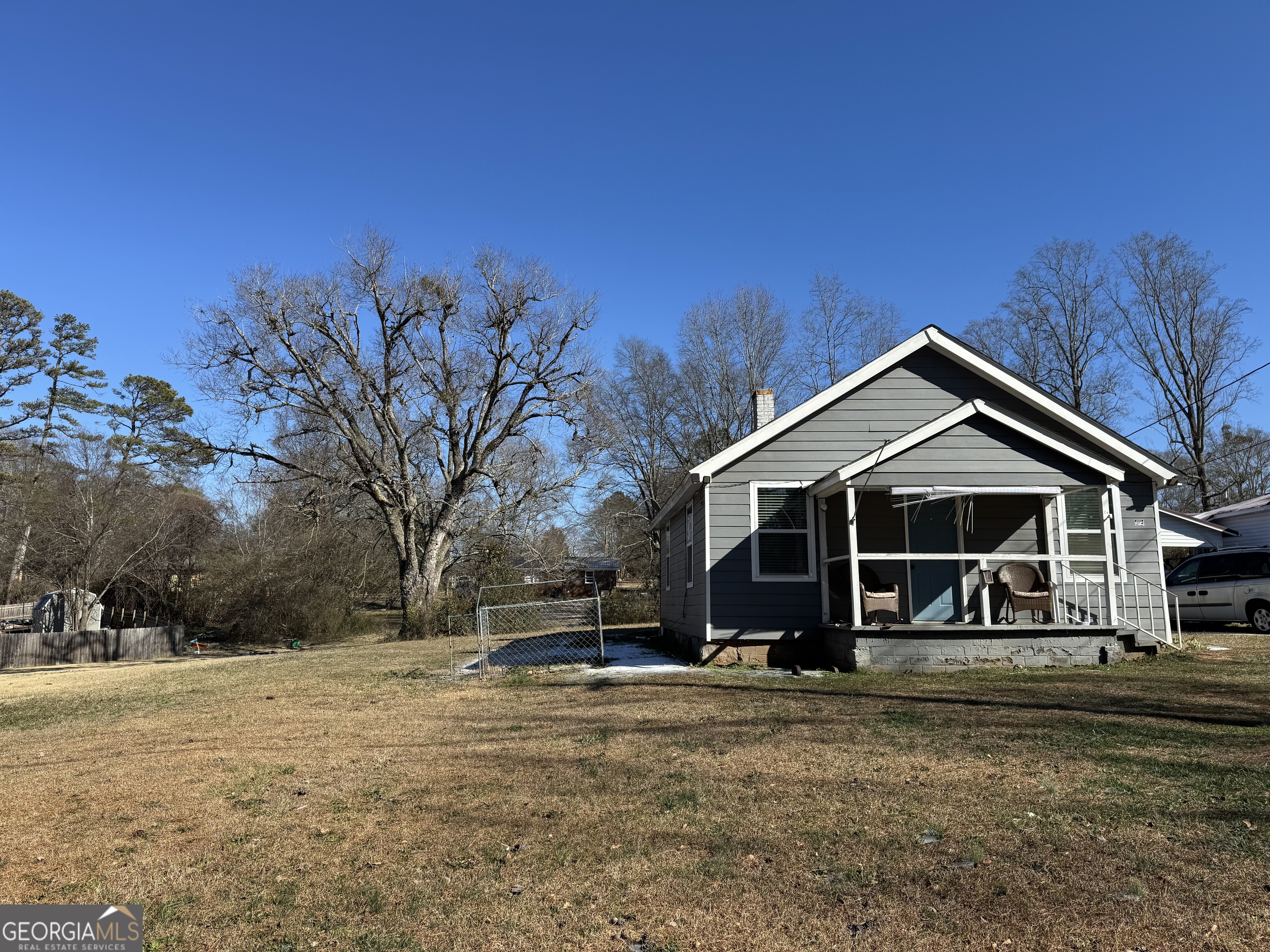 406 Shankle Road Commerce, GA 30529 - Photo 4 of 19 a view of a house with a yard covered in snow