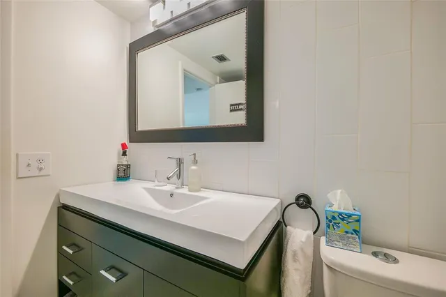 a spacious bedroom with a bed and a couch