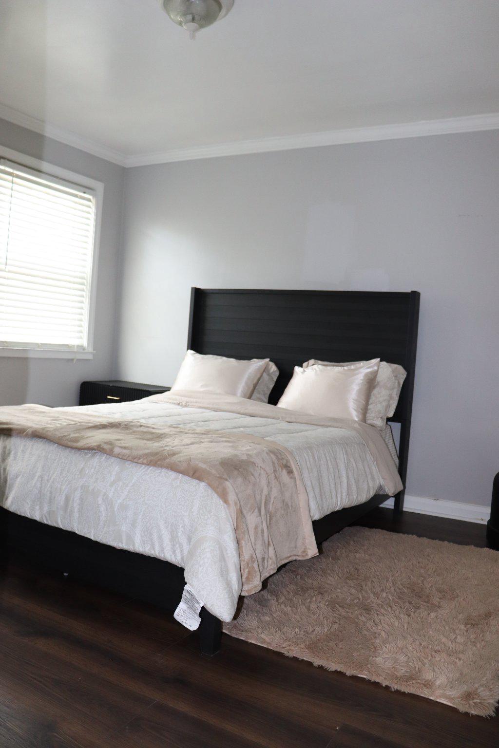 1328 Cedarcroft Road Baltimore, MD 21239 - Photo 21 of 39 Elegant primary bedroom with hardwood floors.