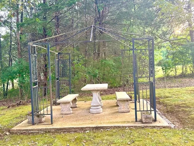 a view of a swimming pool with a patio