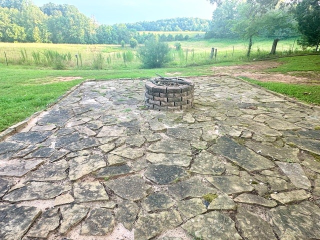 3586 River Road Baxter, TN 38544 - Photo 6 of 8 a backyard of a house with a yard and outdoor seating